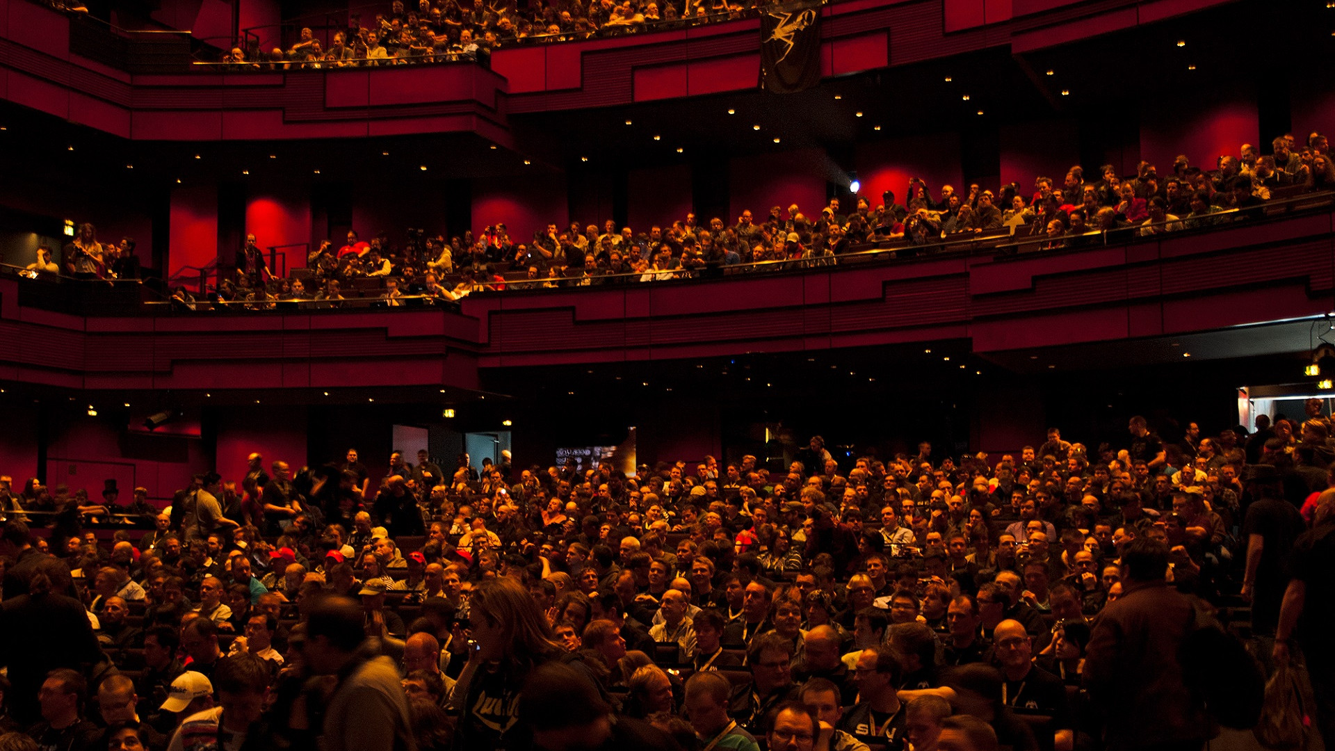 A packed auditorium at EVE Fanfest 2018 in Reykjavik, attendees filling the floor and balconies of the hall.